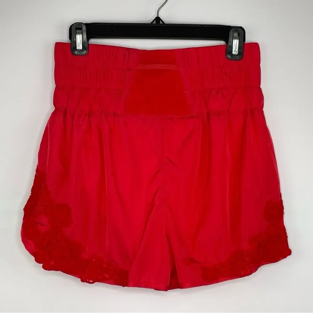 FP Movement Free People neon orange high waisted shorts size Medium
